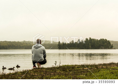 Man watching at lake of two rivers algonquin 35593093