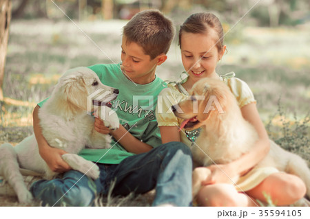 Retriever pup Lovely scene young teen sister Retriever pup Lovely scene young teen sister 35594105