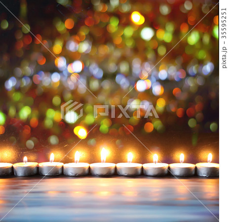 Burning candles on decoration background. 35595251