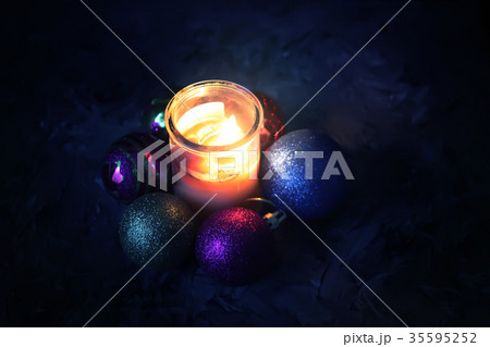 Burning candle on christmas decoration background. 35595252