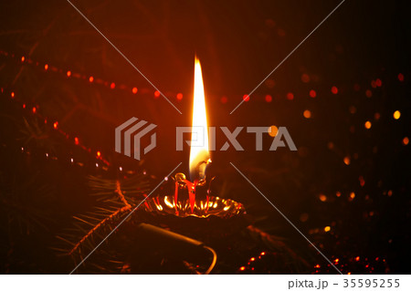 Burning candle flame 35595255