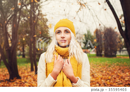 Pretty Autumn Woman with Yellow Cotton Scarf 35595403