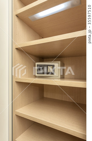Safe box for storing valuables in a wooden Safe box for storing valuables in a wooden 35597510