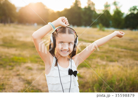 funny girl listening music and dancing 35598879