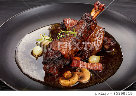 close-up of a portion of Coq Au Vin 35599519