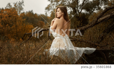 Beautiful girl in a white dress and autumn 35601868