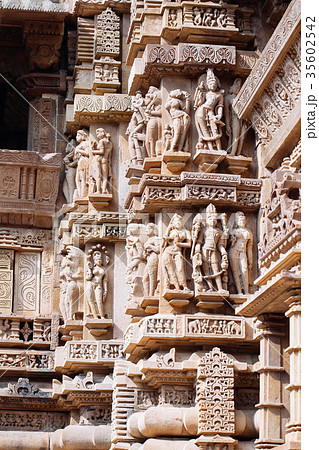 Ancient bas-relief at temple in Khajuraho, India. Ancient bas-relief at temple in Khajuraho, India. 35602542