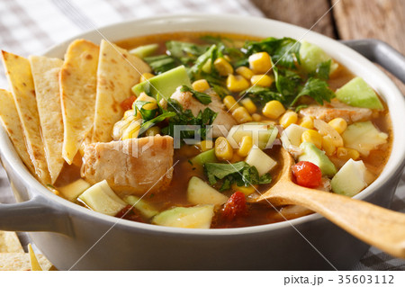 tortilla soup with chicken, tomatoes, avocado 35603112