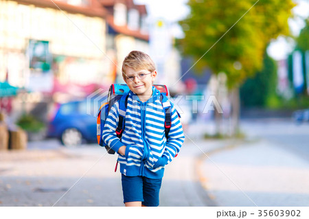 little kid boy with school satchel on first day to little kid boy with school satchel on first day to 35603902