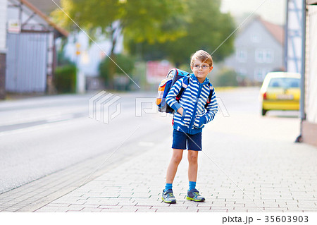 little kid boy with school satchel on first day to little kid boy with school satchel on first day to 35603903
