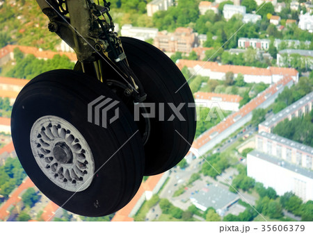 Extended landing gear in the air in flight Extended landing gear in the air in flight 35606379