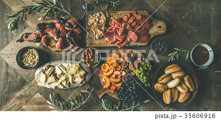 Meat, cheese, olives, sandwiches, prosciutto, buns 35606916