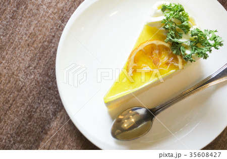 Closeup lemon cake on white plate in coffee shop 35608427