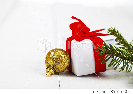 Gifts with red bows and Christmas decorations 35615482