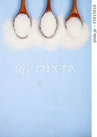 Three wooden spoons with sugar Three wooden spoons with sugar 35615618
