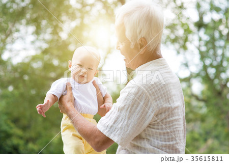 Grandparent and grandchild at outdoor park. 35615811