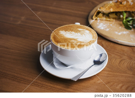 Cup of cappuccino and Apple strudel  35620288