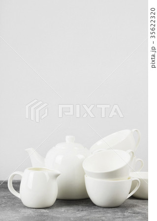 Clean white tableware (teapot, cups, saucers) 35622320