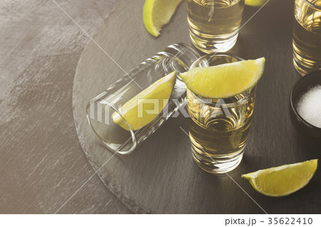Tequila with lime and salt on a dark background 35622410