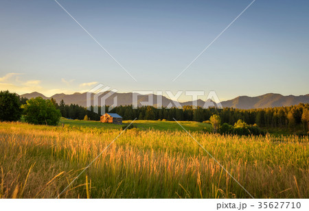 Summer sunset with an old barn in rural Montana Summer sunset with an old barn in rural Montana 35627710