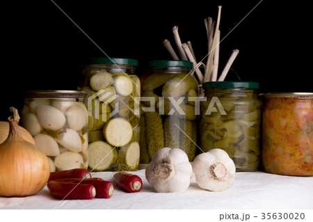 Jars with pickled vegetables on dark background 35630020