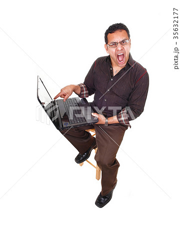 Upset man with laptop. Upset man with laptop. 35632177