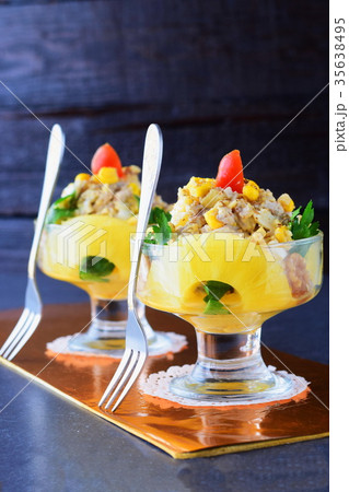 Salad with chicken fillet, pineapple in a glass 35638495