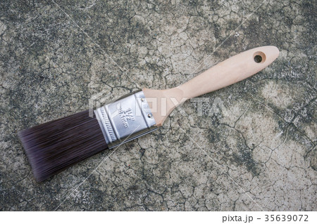 New paintbrush on the floor background New paintbrush on the floor background 35639072