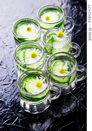Cucumber water in six little mason glass jar 35641477