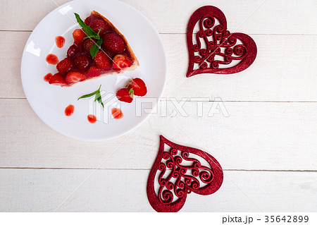 Strawberry pie on white plate and white wooden Strawberry pie on white plate and white wooden 35642899