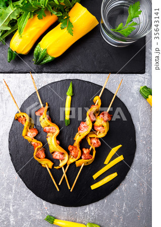 Zucchini and chicken kebab on wooden Zucchini and chicken kebab on wooden 35643141