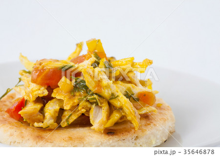 Colombian arepa topped with chicken breast 35646878