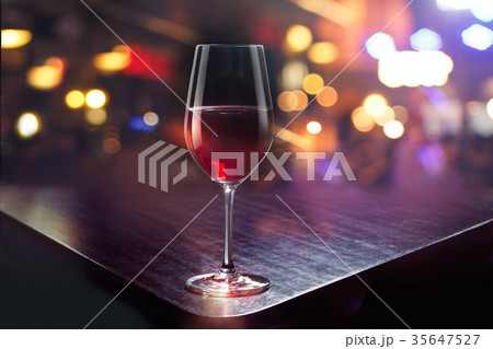Wine glass on the colorful bar background 35647527