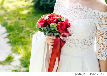 Bride with bouquet, closeup Bride with bouquet, closeup 35647547