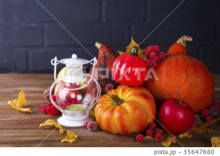 Lantern with candle, pumpkins and autumn 35647680