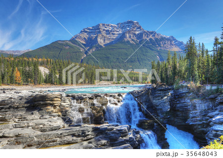 Athabasca Falls with Rocky Mountain peak behind 35648043