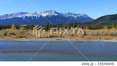 Rocky Mountain peaks with Athabasca River 35648048