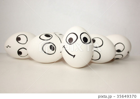 smiling funny eggs with a face on a white smiling funny eggs with a face on a white 35649370