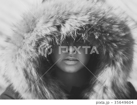 Beautiful girl in a hood with fur of a winter jack 35649604