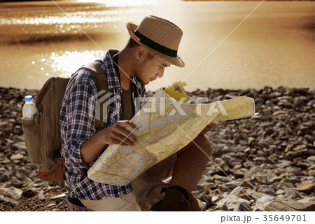 Young Asian tourist man with backpack Young Asian tourist man with backpack 35649701