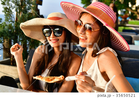Beautiful girl is eating the beach happy. Beautiful girl is eating the beach happy. 35650521