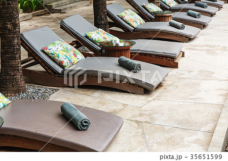 Sunbeds near pool 35651599