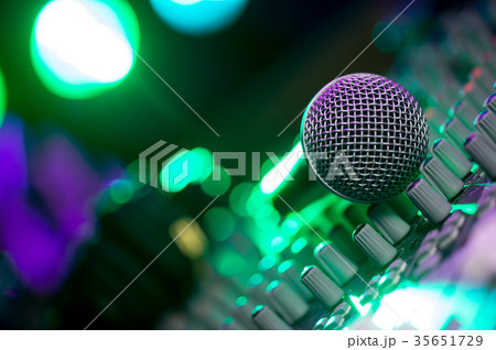 Microphone and Headphones on dirty sound mixer panel 35651729