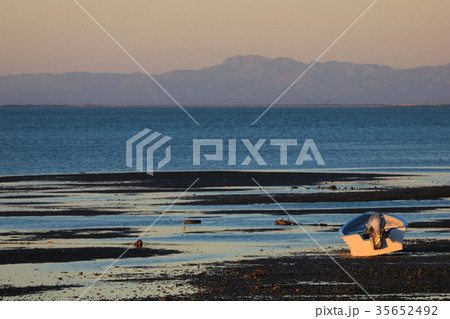 Fishing boat at sunset in the bay of the San 35652492
