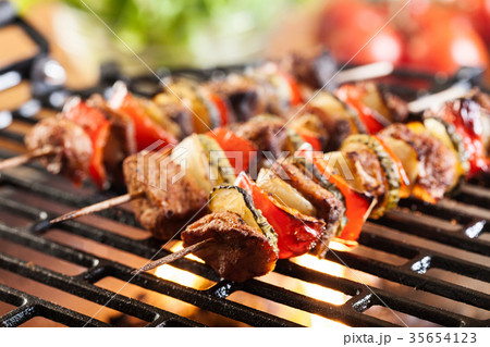 Grilling shashlik on barbecue grill 35654123