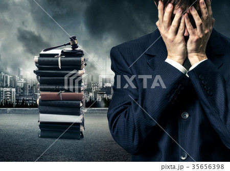 Man in suit closing eyes with hands Man in suit closing eyes with hands 35656398