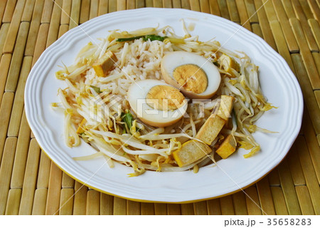 boiled brown egg and stir fried bean sprout boiled brown egg and stir fried bean sprout 35658283
