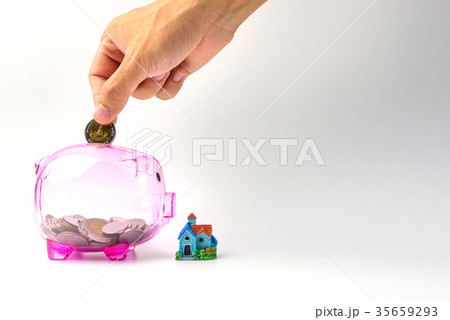 Hand drop coins on Clear pink Piggy bank 35659293