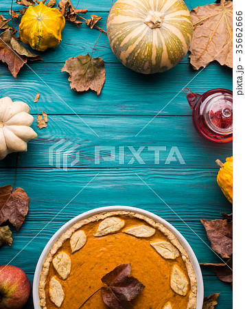 Green autumn background with pumpkin pie Green autumn background with pumpkin pie 35662666