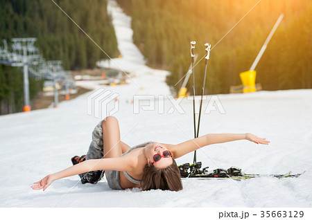 Sexy woman skier on snowy slope at ski resort Sexy woman skier on snowy slope at ski resort 35663129